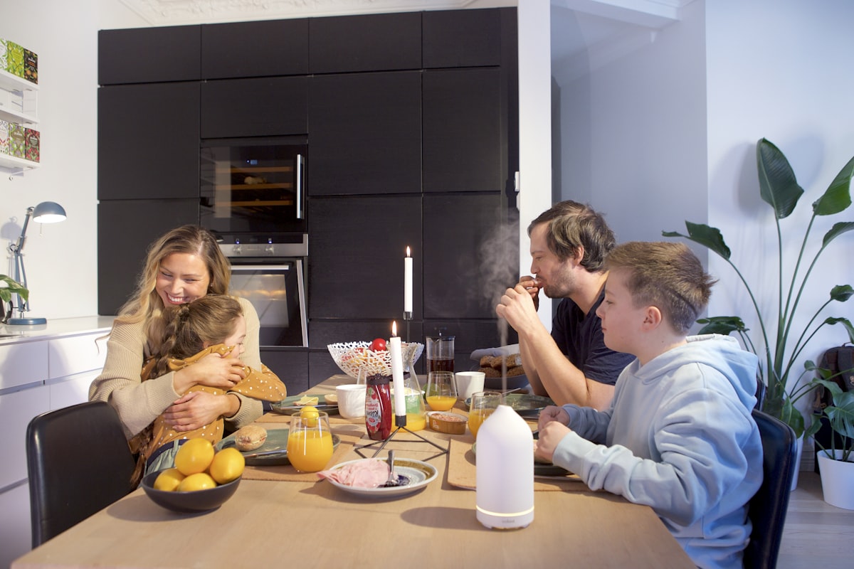 People of different ages sitting around a table together